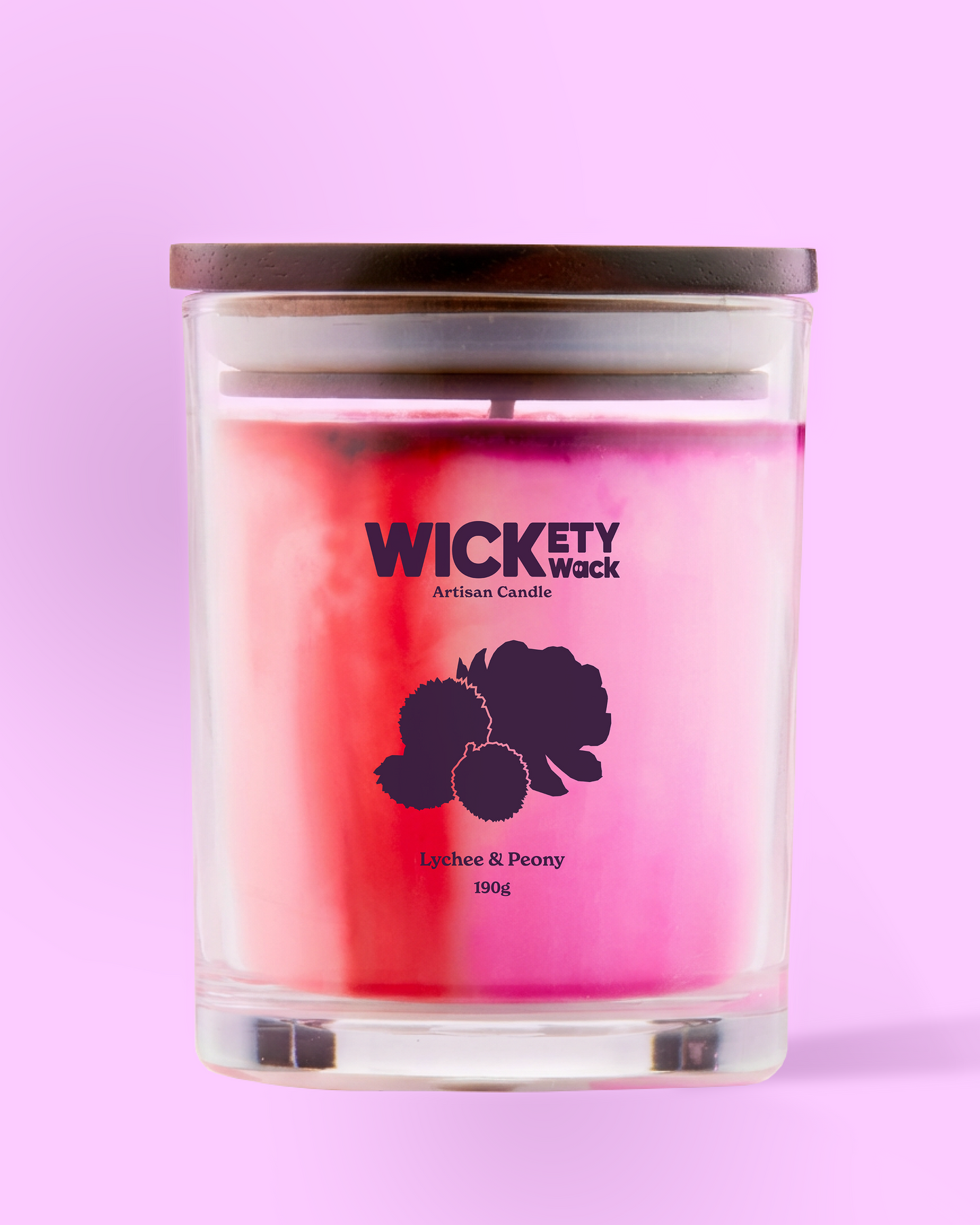 Candle with 'Wickety Wick' branding on a pink background