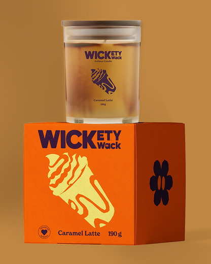 Wickety Wack candle and packaging on a brown background