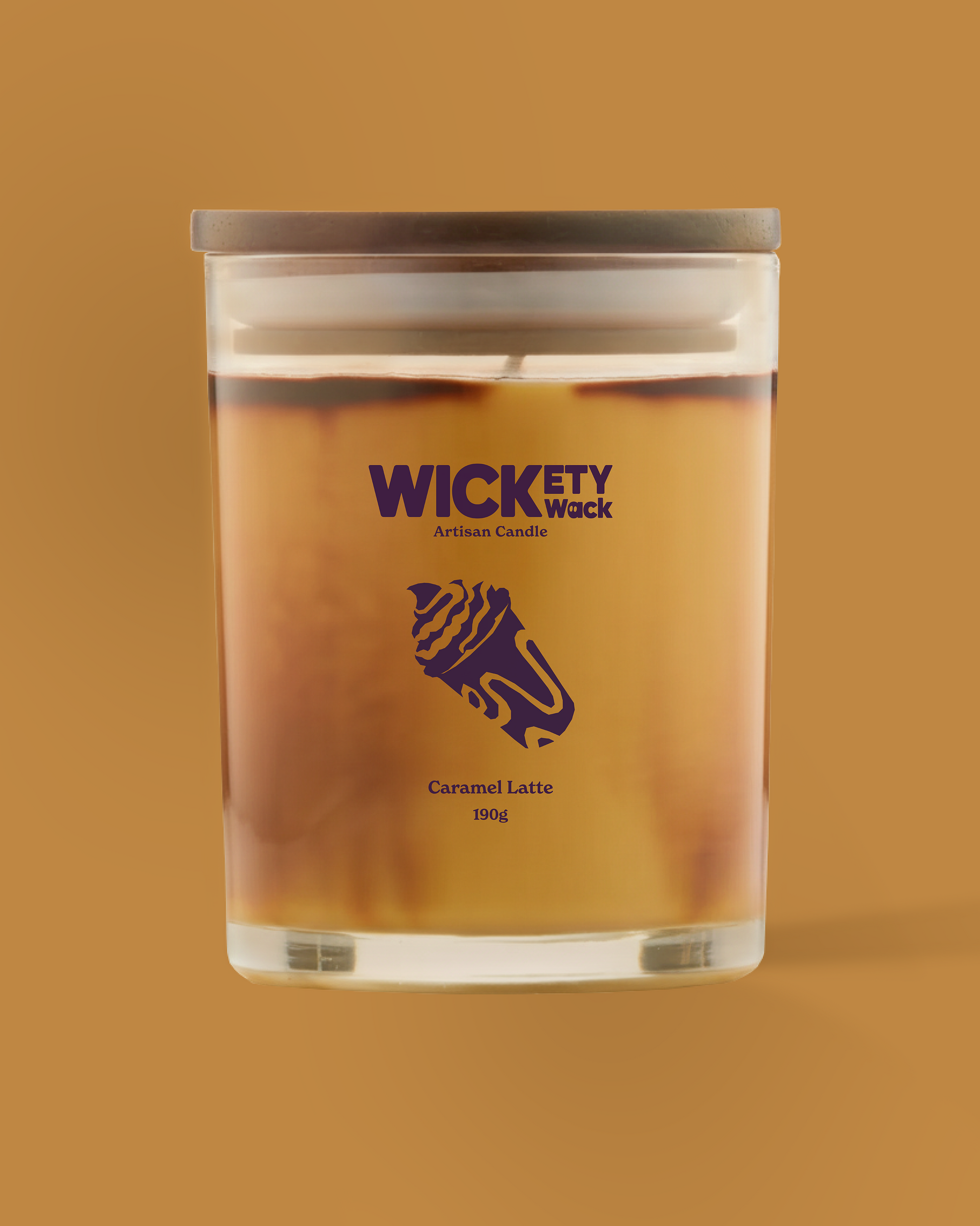 Candle in a glass jar with 'Wickety Wick' branding on a brown background